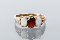 Lot 1696 - VICTORIAN STYLE OPAL AND GARNET RING with oval...