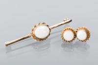 Lot 1697 - OPAL BAR BROOCH set with an oval opal 10.5mm...