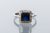 Lot 1699 - ART DECO SAPPHIRE AND DIAMOND RING the central...
