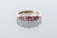 Lot 1701 - RUBY AND DIAMOND RING set with three rubies...