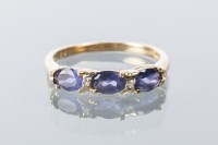 Lot 1705 - IOLITE AND DIAMOND DRESS RING set with three...