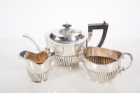 Lot 263 - EDWARDIAN SILVER THREE-PIECE TEA SERVICE maker...