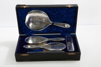Lot 289 - GEORGE V SILVER VANITY SET maker Synyer &...