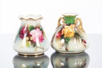 Lot 469 - TWO ROYAL WORCESTER SMALL VASES of squat...