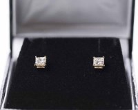 Lot 1650 - PAIR OF DIAMOND STUD EARRINGS each set with a...