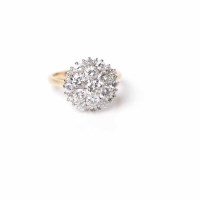 Lot 1693 - IMPRESSIVE DIAMOND CLUSTER RING the pierced...