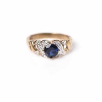 Lot 1703 - BLUE CZ RING with a central blue CZ, on...