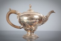 Lot 4 - GEORGE III SILVER TEAPOT of circular form and...