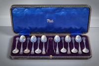 Lot 70 - SET OF TWELVE SILVER TEASPOONS AND TONGS IN...