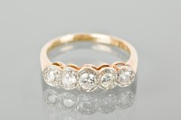Lot 1125 - DIAMOND FIVE STONE RING the brilliant cut...