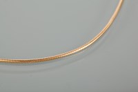 Lot 1134 - EIGHTEEN CARAT GOLD SNAKE LINK CHAIN 42cm long,...