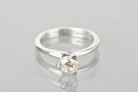 Lot 1138 - DIAMOND SOLITAIRE RING the brilliant cut stone...
