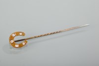 Lot 1155 - VICTORIAN DIAMOND SET HORSE SHOE MOTIF PIN the...