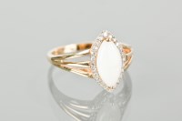 Lot 1175 - OPAL AND DIAMOND CLUSTER RING with a marquise...