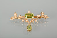 Lot 1179 - EDWARDIAN PERIDOT AND SEED PEARL BROOCH of...