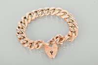 Lot 1187 - NINE CARAT GOLD CURB LINK BRACELET with a...