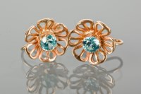 Lot 1190 - GOLD AND BLUE ZIRCON FLOWER EARRINGS of...