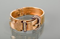 Lot 1191 - VICTORIAN BUCKLE MOTIF BANGLE with an engraved...