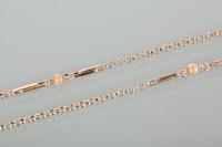 Lot 1193 - NINE CARAT GOLD CHAIN with round, long and...