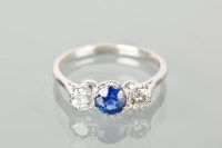 Lot 1199 - SAPPHIRE AND DIAMOND THREE STONE RING the...