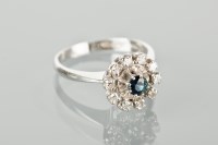 Lot 1201 - SAPPHIRE AND DIAMOND CLUSTER RING with a...