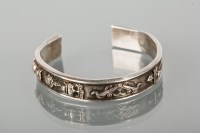 Lot 1214 - CHINESE SILVER BANGLE heavy gauge depicting...