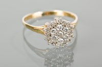 Lot 1216 - DIAMOND CLUSTER RING with a cluster of...
