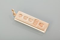 Lot 1238 - NINE CARAT GOLD INGOT PENDANT with full...