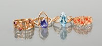 Lot 1265 - TWO 1970S DRESS RINGS comprising one set with...