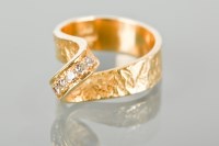 Lot 1266 - 1970S DIAMOND SET RING the broad textured band...