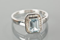 Lot 1282 - AQUAMARINE AND DIAMOND CLUSTER RING with a...