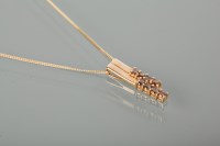 Lot 1288 - COGNAC DIAMOND PENDANT set with eight...