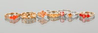 Lot 1292 - GROUP OF SEVEN RED AND ORANGE GEM SET RINGS...