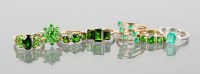 Lot 1299 - GROUP OF SEVEN NINE CARAT GOLD GREEN GEM SET...