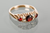 Lot 1304 - GARNET AND WHITE GEM SET RING the Victorian...
