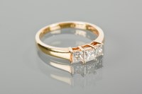 Lot 1306 - DIAMOND THREE STONE RING set with three...