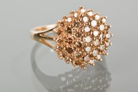 Lot 1310 - COGNAC DIAMOND CLUSTER RING set with a large...