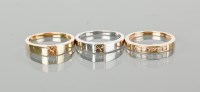 Lot 1314 - GROUP OF THREE COGNAC DIAMOND RINGS two set...