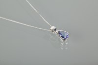 Lot 1343 - TANZANITE PENDANT set with a pear cut...
