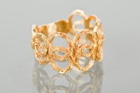 Lot 1348 - 1970S EIGHTEEN CARAT GOLD RING of textured...