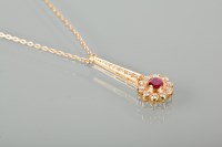 Lot 1352 - RUBY AND DIAMOND CLUSTER PENDANT NECKLACE set...