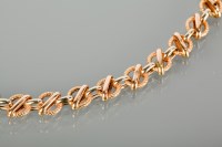 Lot 1357 - EIGHTEEN CARAT GOLD CHAIN BRACELET with...