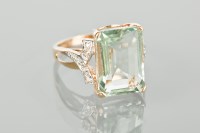 Lot 1379 - GEM AND DIAMOND DRESS RING the large emerald...