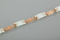 Lot 1380 - GREEN JADE AND GOLD BRACELET formed by six...