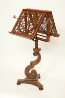 Lot 321 - VICTORIAN FIGURED WALNUT DUET STAND with fret...