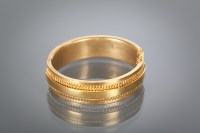 Lot 1113 - VICTORIAN BANGLE with overlaid decoration,...