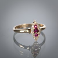 Lot 1117 - EARLY TWENTIETH CENTURY RUBY AND DIAMOND DRESS...