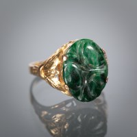 Lot 1118 - UNUSUAL JADE SET DRESS RING set with a carved...