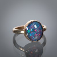 Lot 1136 - CREATED OPAL DRESS RING the synthetic oval...