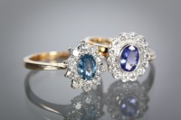 Lot 1137 - SAPPHIRE AND DIAMOND CLUSTER RING the central...